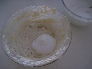 Add a third of the beaten egg to the vanilla flavoured ricotta