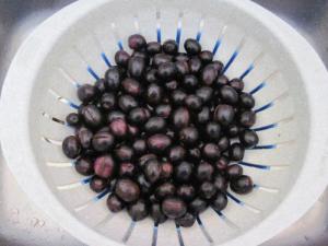 Pour olives through a colander