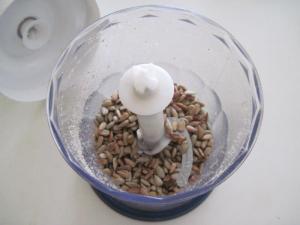 Toasted sunflower seeds in grinder